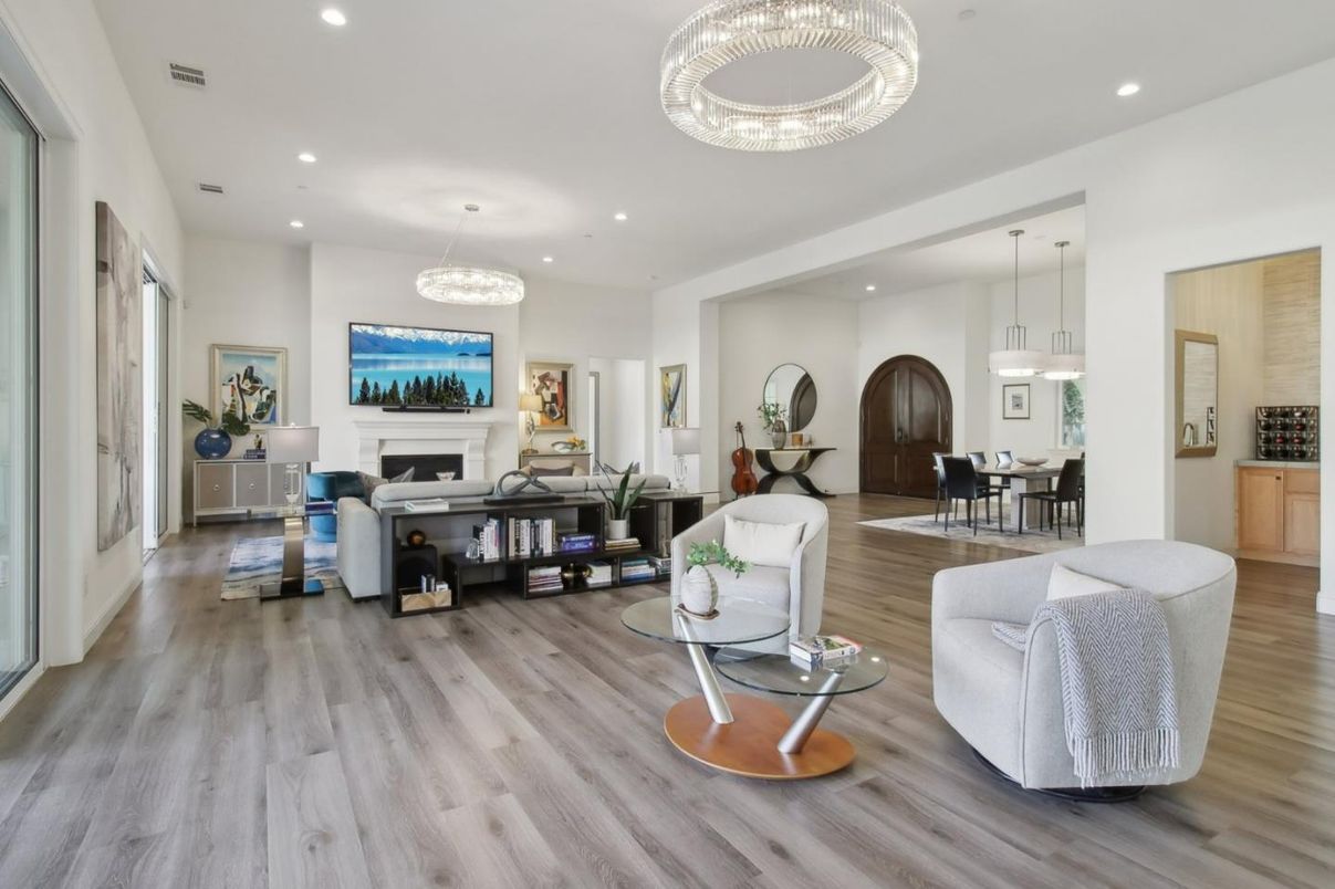 Chandelier, Dining room, Fireplace, Interior, Living room, Pendant Lights, Recessed Lighting, Wood Texture Flooring