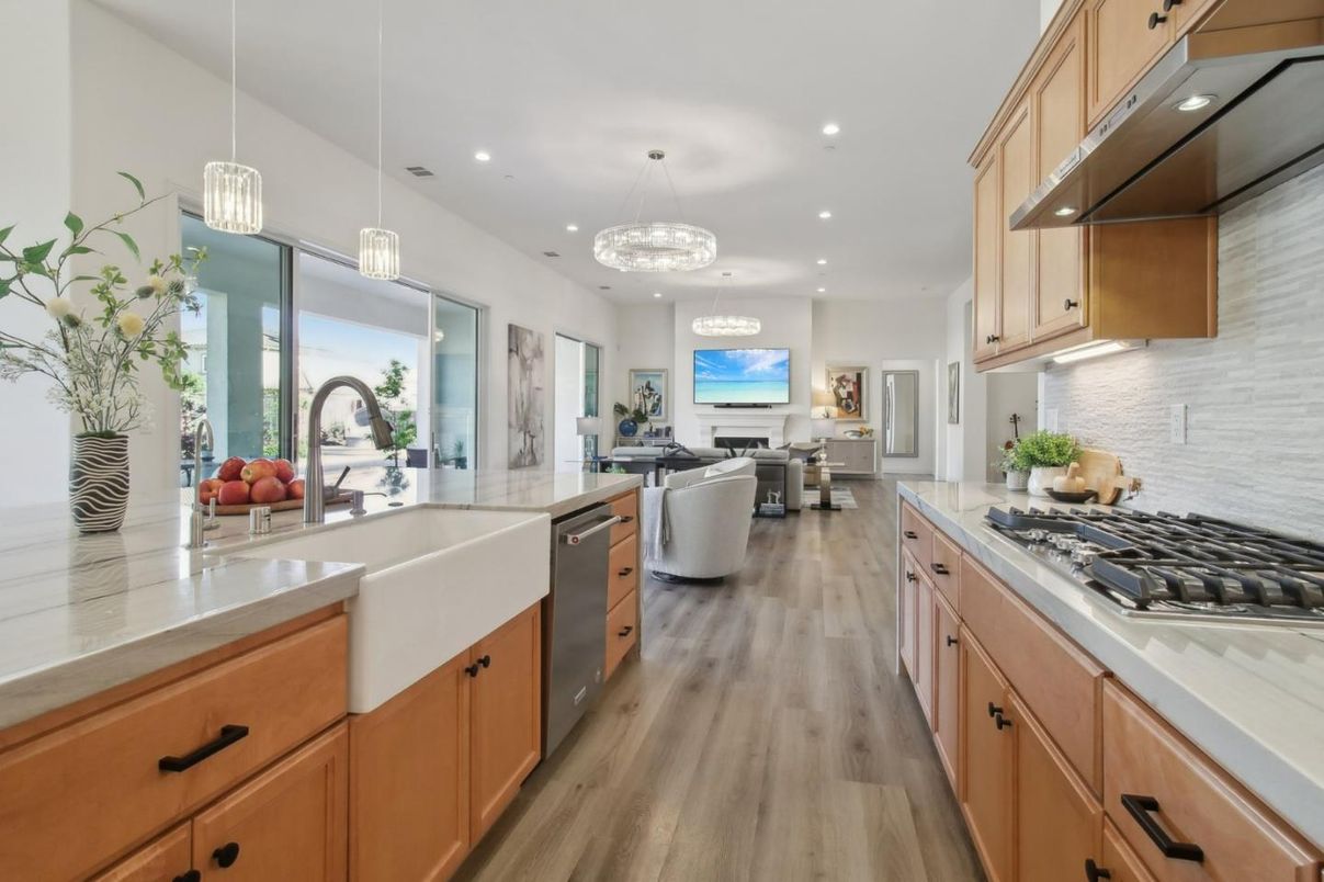 Chandelier, Dining room, Fireplace, Interior, Kitchen, Living room, Pendant Lights, Recessed Lighting, Stainless Steel Appliances, Wood Texture Flooring