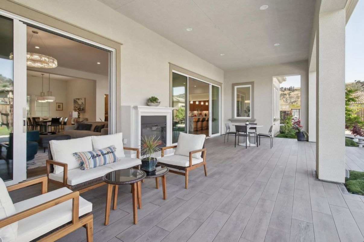 Dining room, Exterior, Fireplace, Living room, Pendant Lights, Recessed Lighting, Wood Texture Flooring