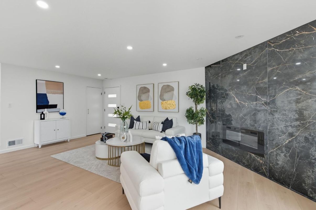 Fireplace, Interior, Living room, Marble Walls, Recessed Lighting, Wood Texture Flooring