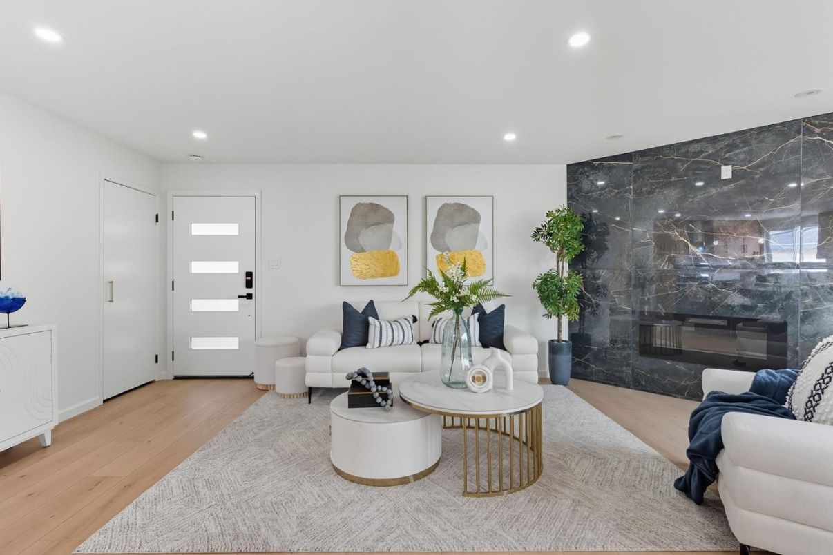 Fireplace, Interior, Living room, Marble Walls, Recessed Lighting, Wood Texture Flooring