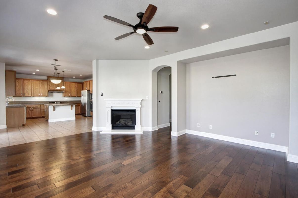 Empty room, Fireplace, Interior, Kitchen, Pendant Lights, Recessed Lighting, Wood Texture Flooring
