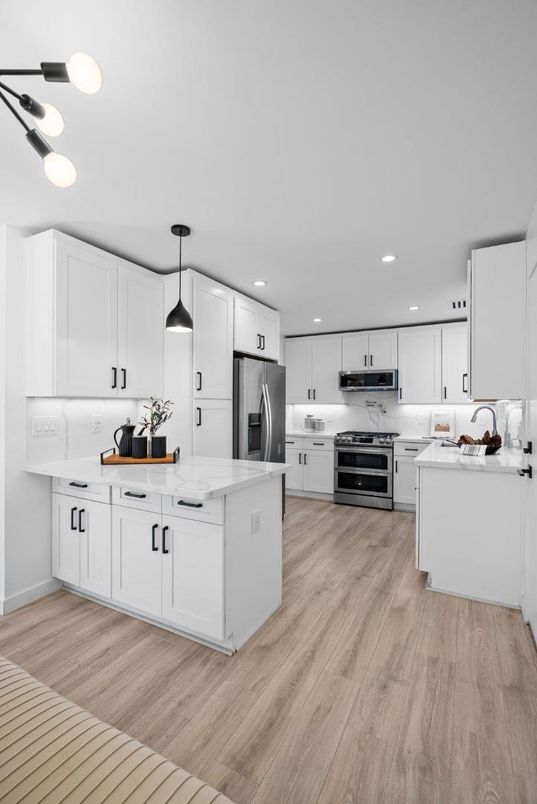 Interior, Kitchen, Pendant Lights, Recessed Lighting, Stainless Steel Appliances, Wood Texture Flooring