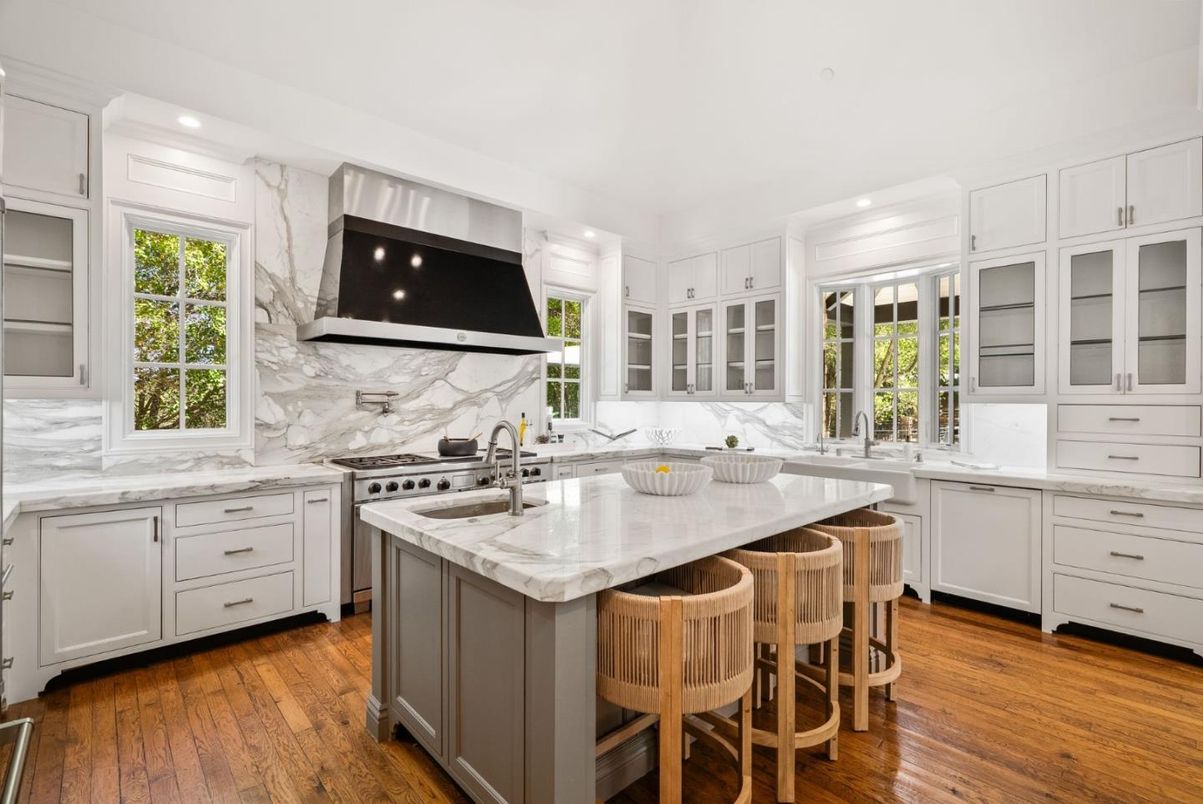 Interior, Kitchen, Marble Walls, Recessed Lighting, Stainless Steel Appliances, Wood Texture Flooring