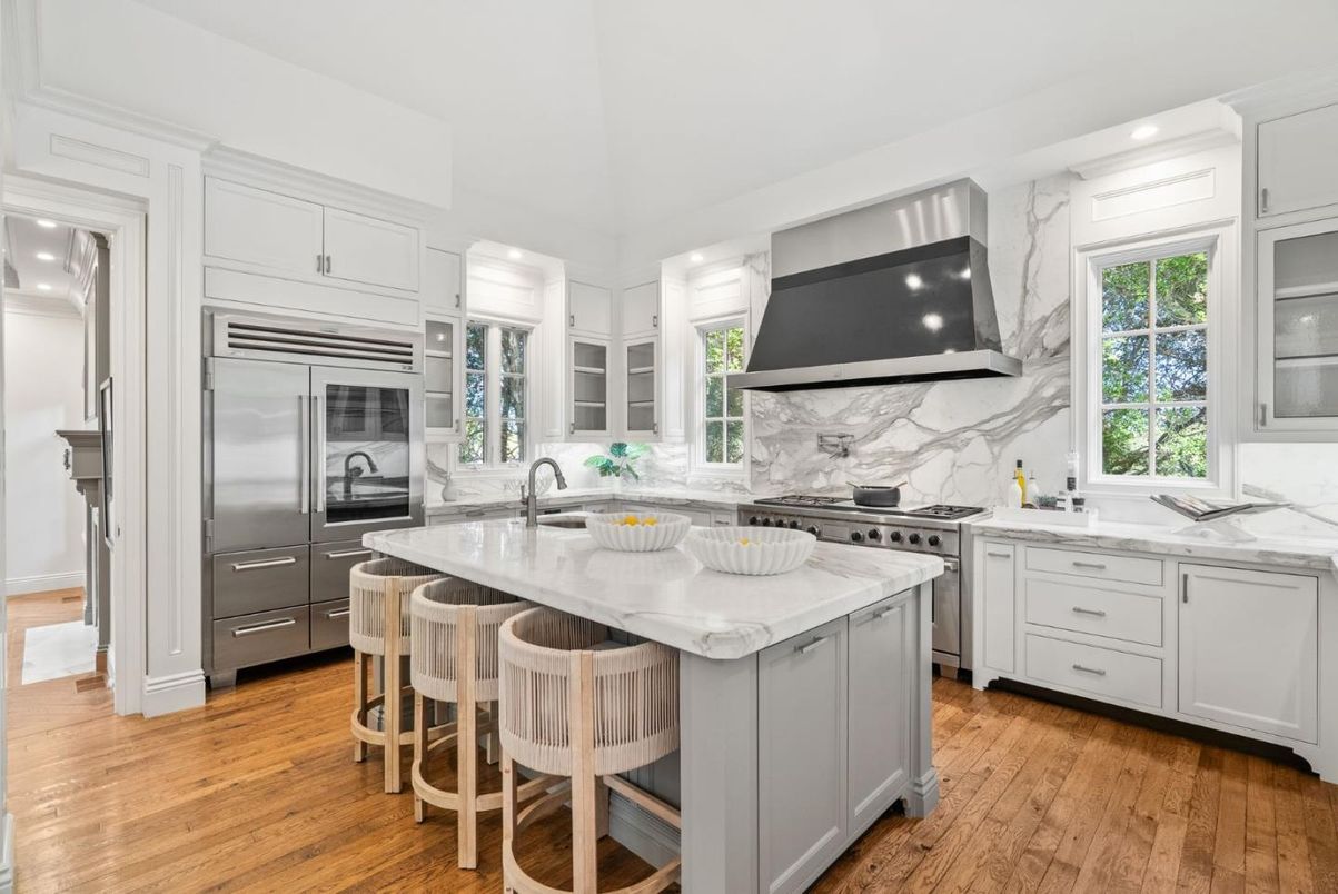 Interior, Kitchen, Marble Walls, Recessed Lighting, Stainless Steel Appliances, Wood Texture Flooring