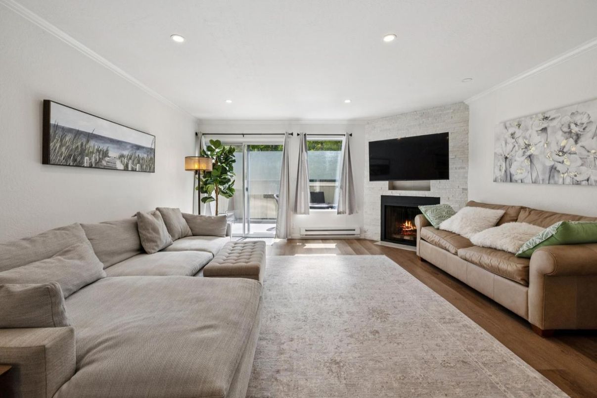 Fireplace, Interior, Living room, Recessed Lighting, Stone Walls, Wood Texture Flooring