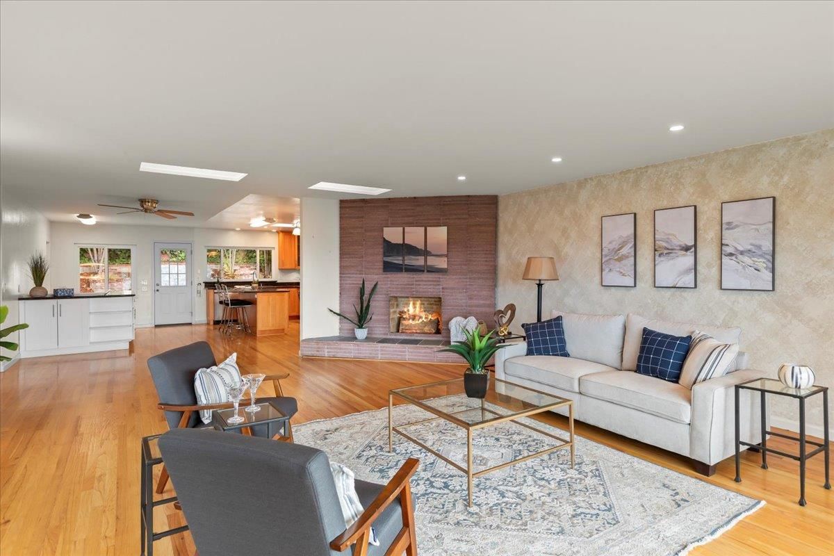 Fireplace, Interior, Living room, Recessed Lighting, Stone Walls, Wood Texture Flooring