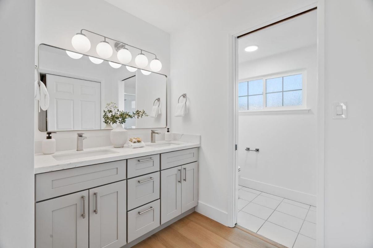 Bathroom, Dual Sink Vanities, Interior, Recessed Lighting, Wood Texture Flooring
