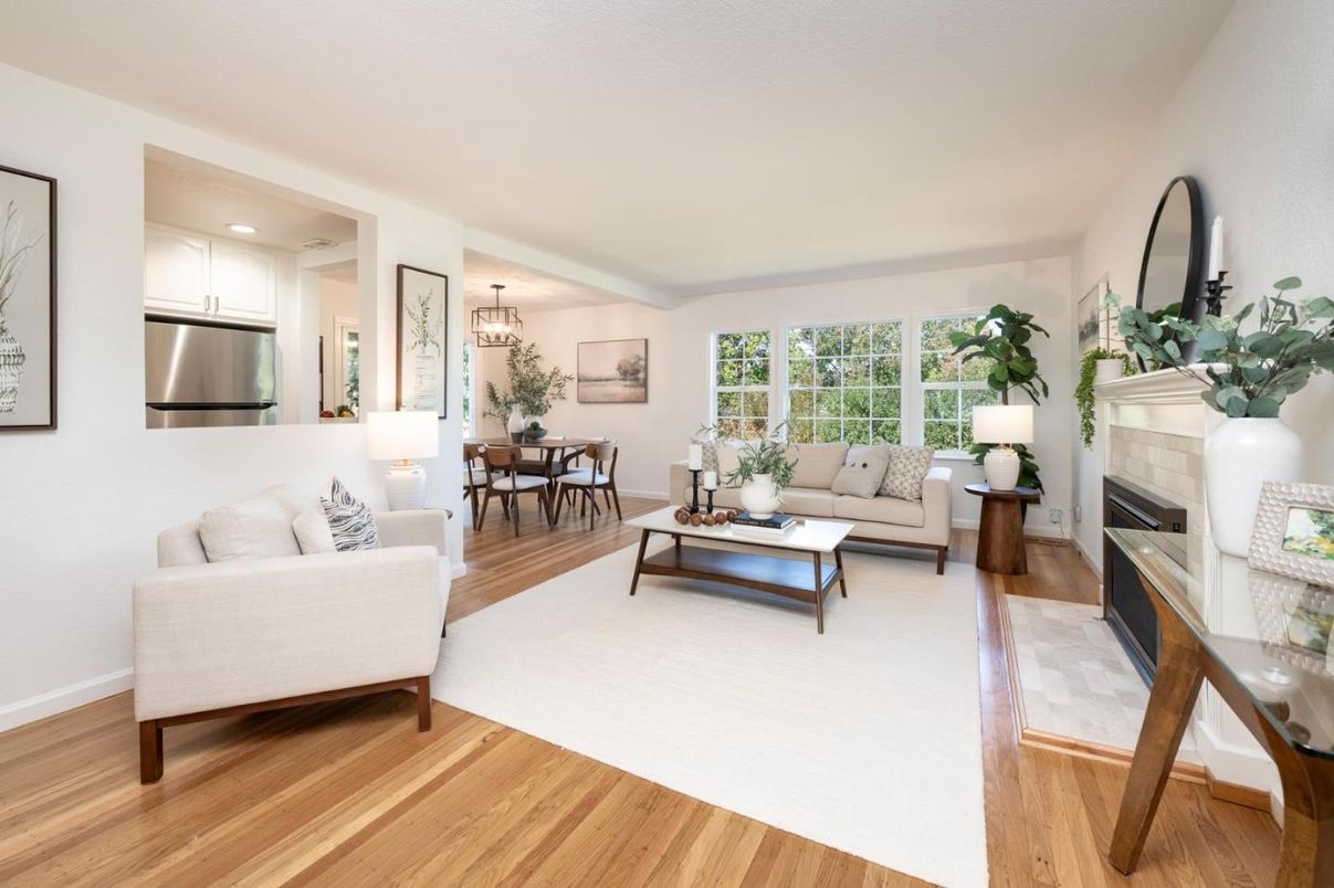 Chandelier, Dining room, Fireplace, Interior, Kitchen, Living room, Recessed Lighting, Stainless Steel Appliances, Wood Texture Flooring