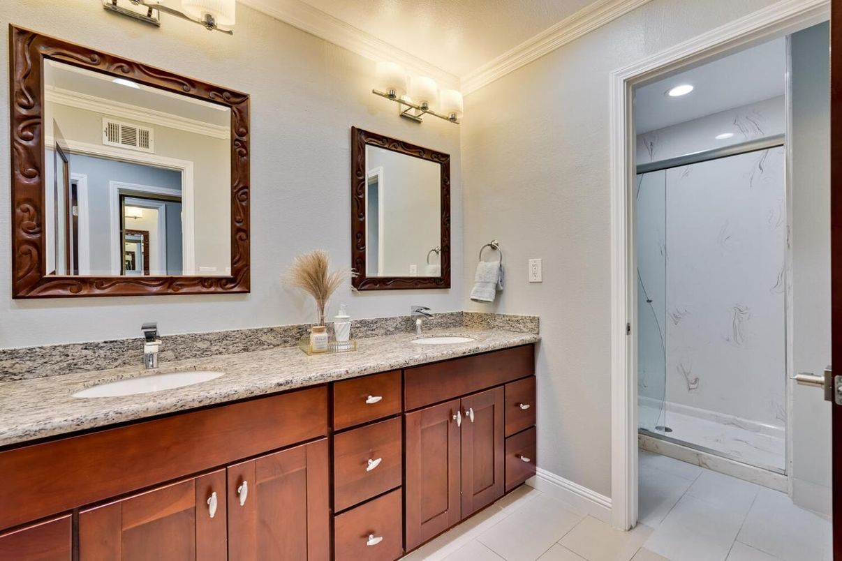 Bathroom, Dual Sink Vanities, Glass Shower, Interior, Marble Walls, Recessed Lighting