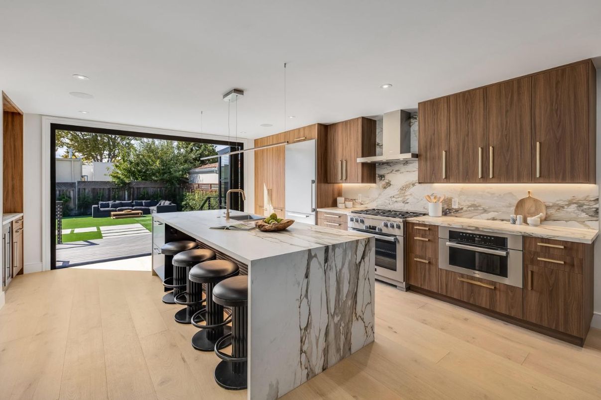 Interior, Kitchen, Marble Walls, Pendant Lights, Recessed Lighting, Stainless Steel Appliances, Wood Texture Flooring