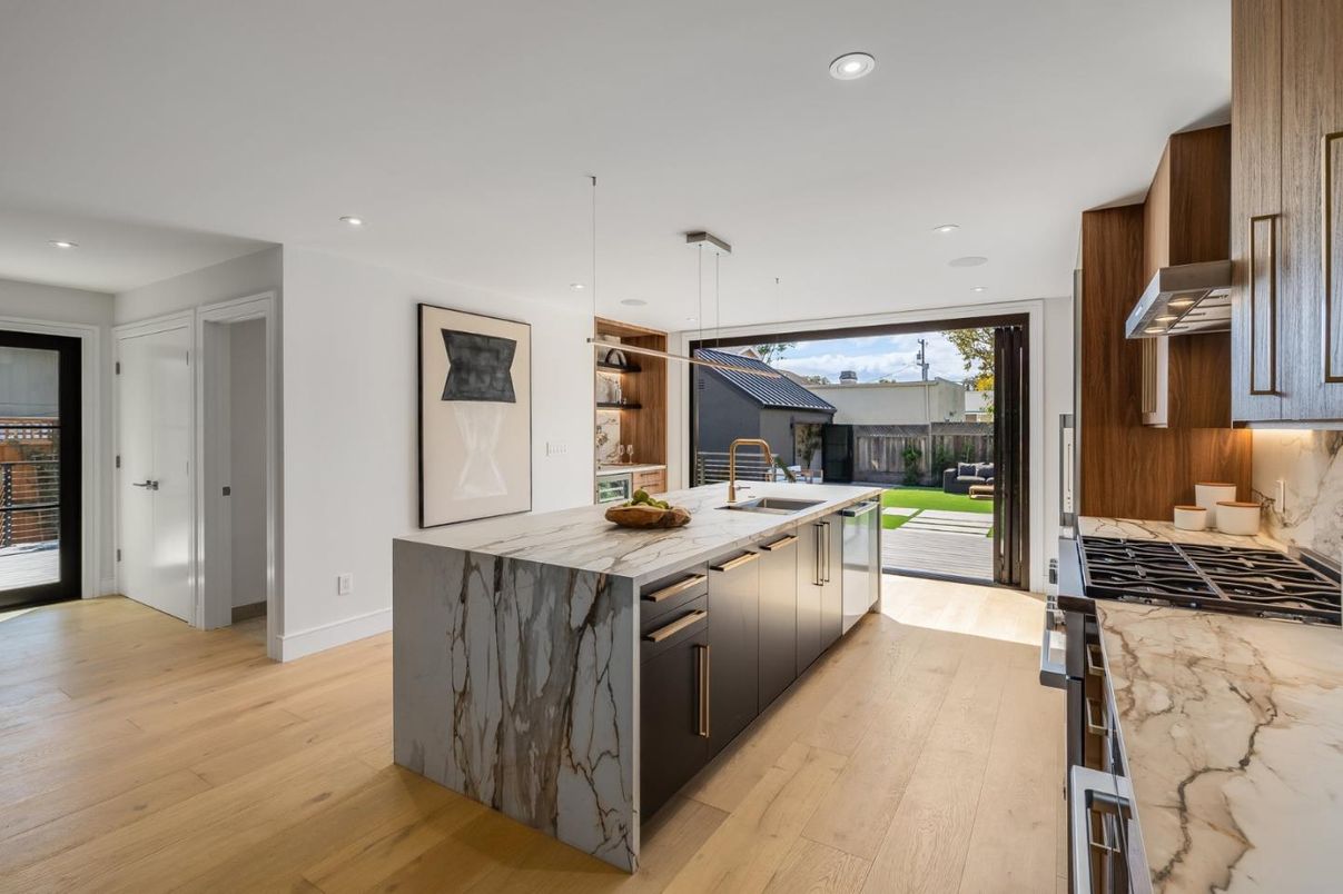 Interior, Kitchen, Marble Walls, Pendant Lights, Recessed Lighting, Stainless Steel Appliances, Wood Texture Flooring