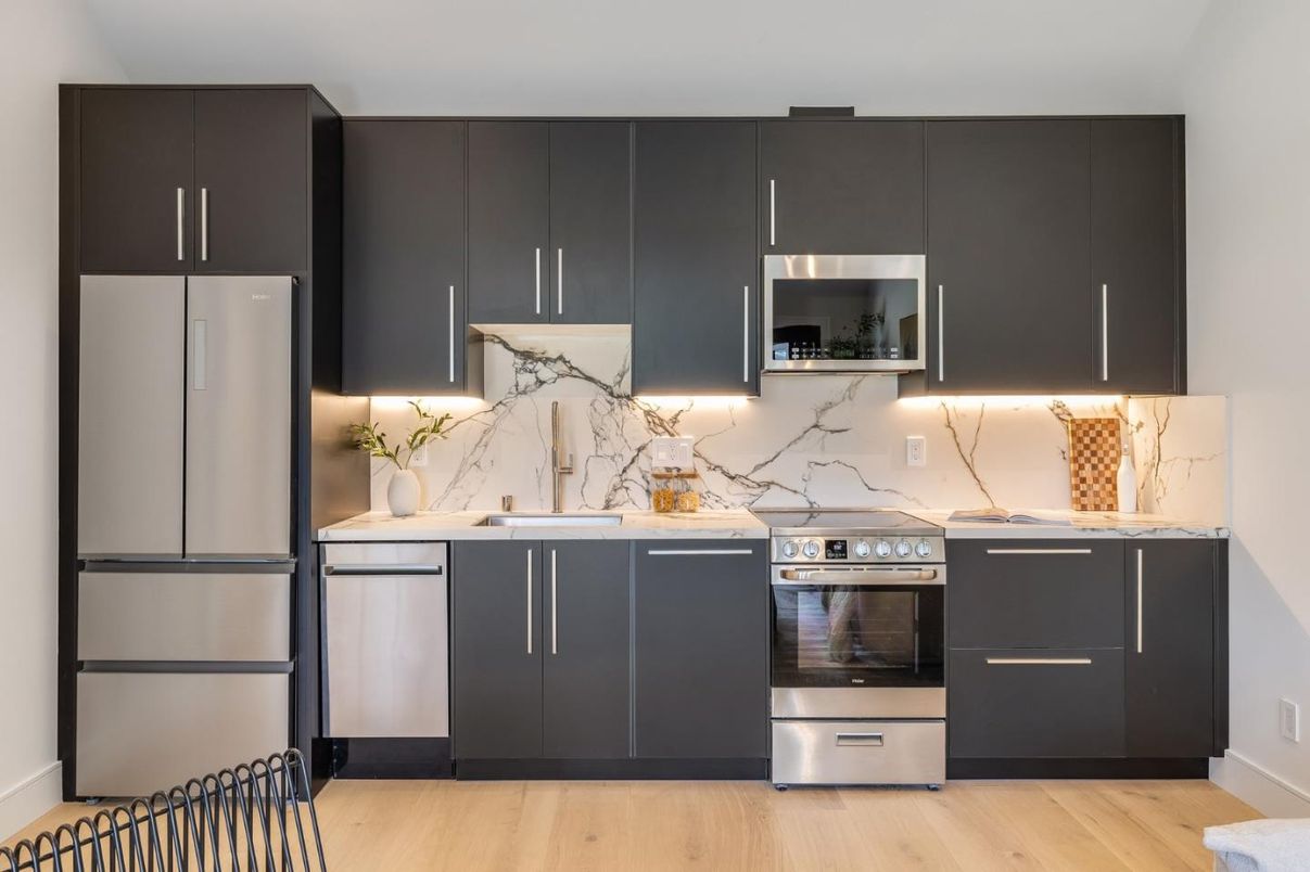 Interior, Kitchen, Marble Walls, Stainless Steel Appliances, Wood Texture Flooring