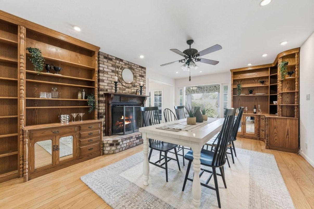 Dining room, Fireplace, Interior, Recessed Lighting, Stone Walls, Wood Texture Flooring