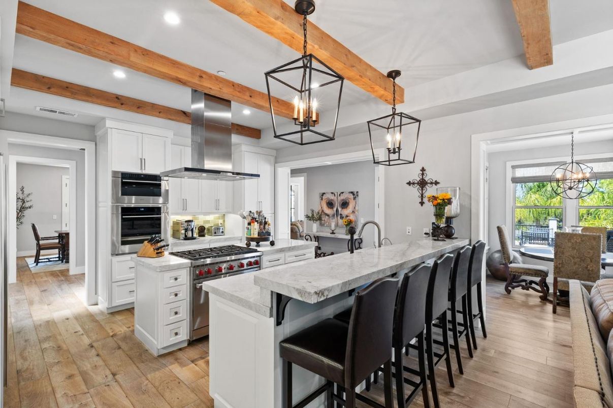 Dining room, Interior, Kitchen, Pendant Lights, Recessed Lighting, Stainless Steel Appliances, Wooden Beams, Wood Texture Flooring