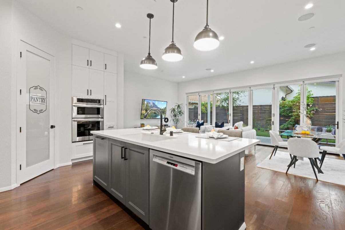 Dining room, Interior, Kitchen, Pendant Lights, Recessed Lighting, Stainless Steel Appliances, Wood Texture Flooring