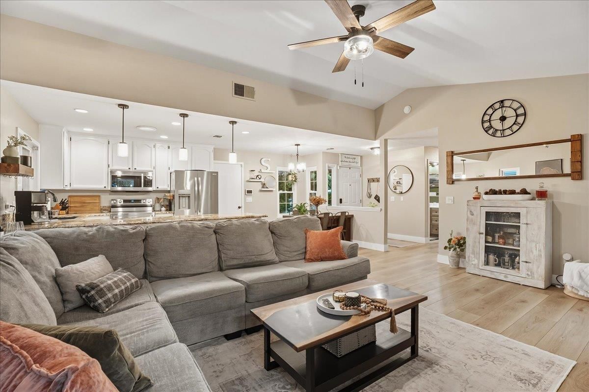 Fireplace, Interior, Kitchen, Living room, Pendant Lights, Recessed Lighting, Stainless Steel Appliances, Wood Texture Flooring