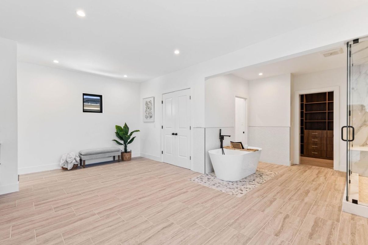 Bathroom, Free Standing Baths, Glass Shower, Interior, Recessed Lighting, Wood Texture Flooring