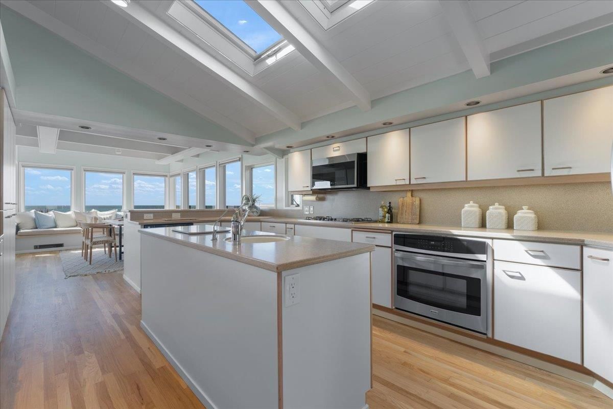 Dining room, Glass Ceilings, Interior, Kitchen, Living room, Recessed Lighting, Stainless Steel Appliances, Water, Wood Texture Flooring