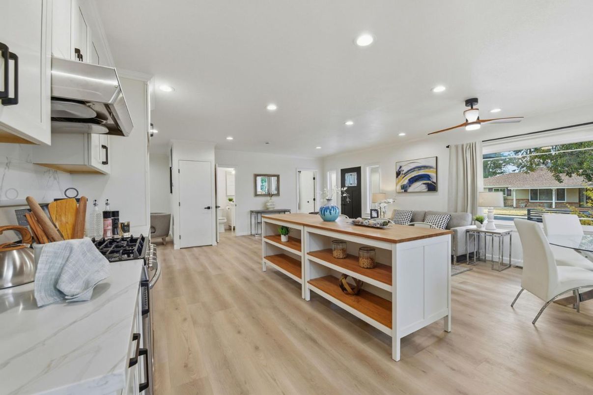Dining room, Interior, Kitchen, Living room, Recessed Lighting, Stainless Steel Appliances, Wood Texture Flooring