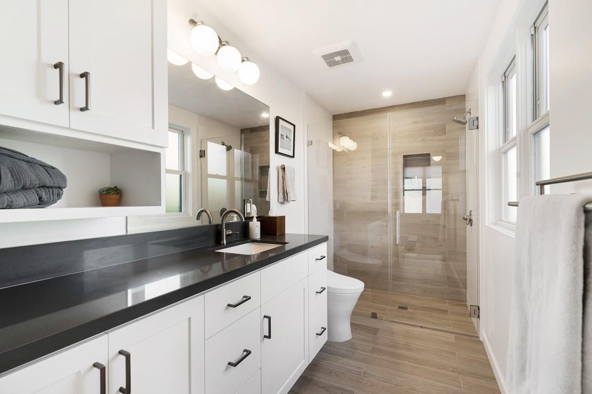 Bathroom, Dual Sink Vanities, Glass Shower, Interior, Recessed Lighting, Wood Texture Flooring