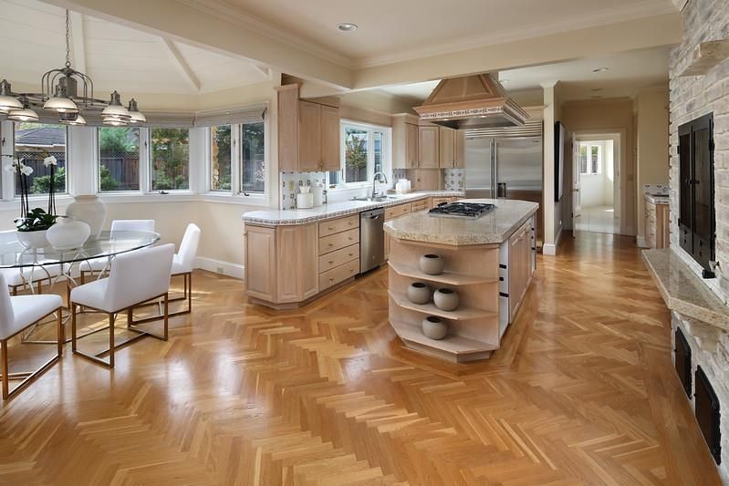 Dining room, Fireplace, Interior, Kitchen, Pendant Lights, Recessed Lighting, Stainless Steel Appliances, Stone Walls, Wood Texture Flooring