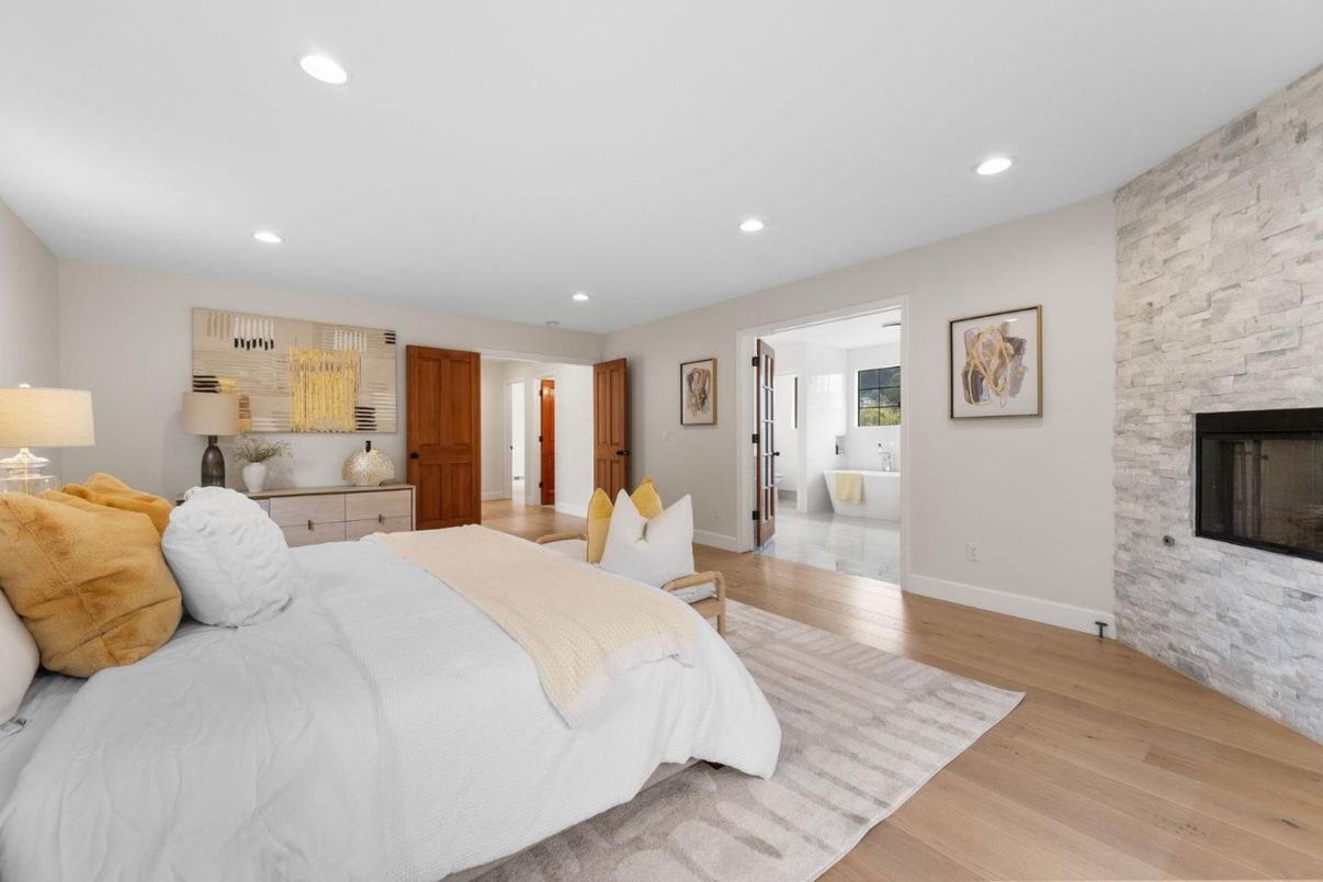 Bedroom, Fireplace, Interior, Recessed Lighting, Stone Walls, Wood Texture Flooring