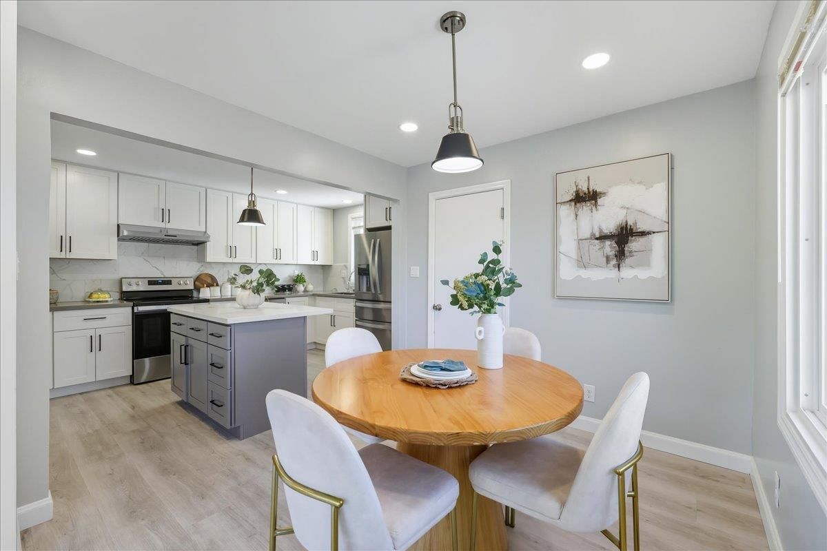 Dining room, Interior, Kitchen, Pendant Lights, Recessed Lighting, Stainless Steel Appliances, Wood Texture Flooring