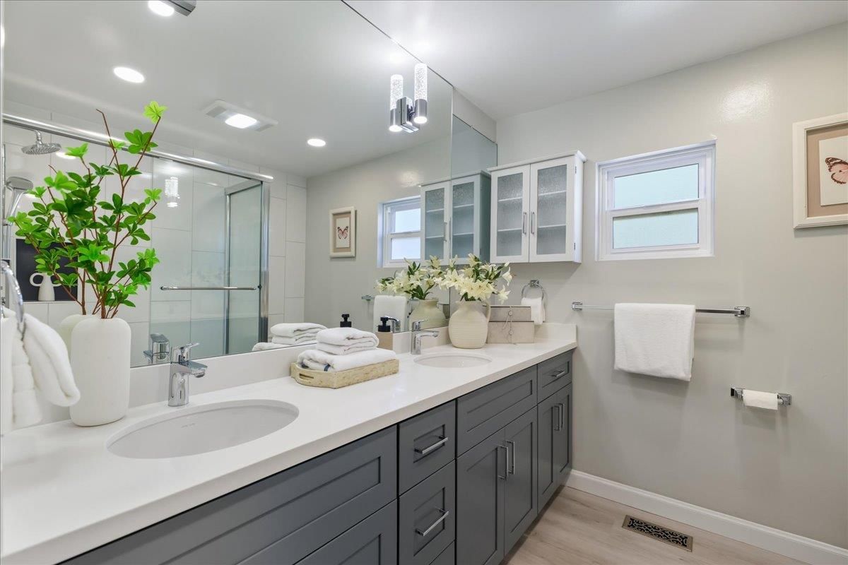 Bathroom, Dual Sink Vanities, Glass Shower, Interior, Recessed Lighting, Wood Texture Flooring