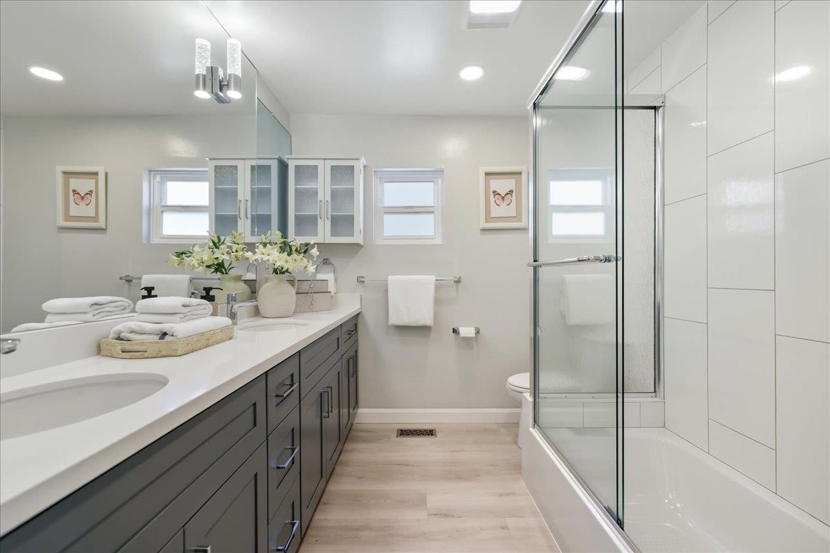 Bathroom, Dual Sink Vanities, Glass Shower, Interior, Recessed Lighting, Wood Texture Flooring