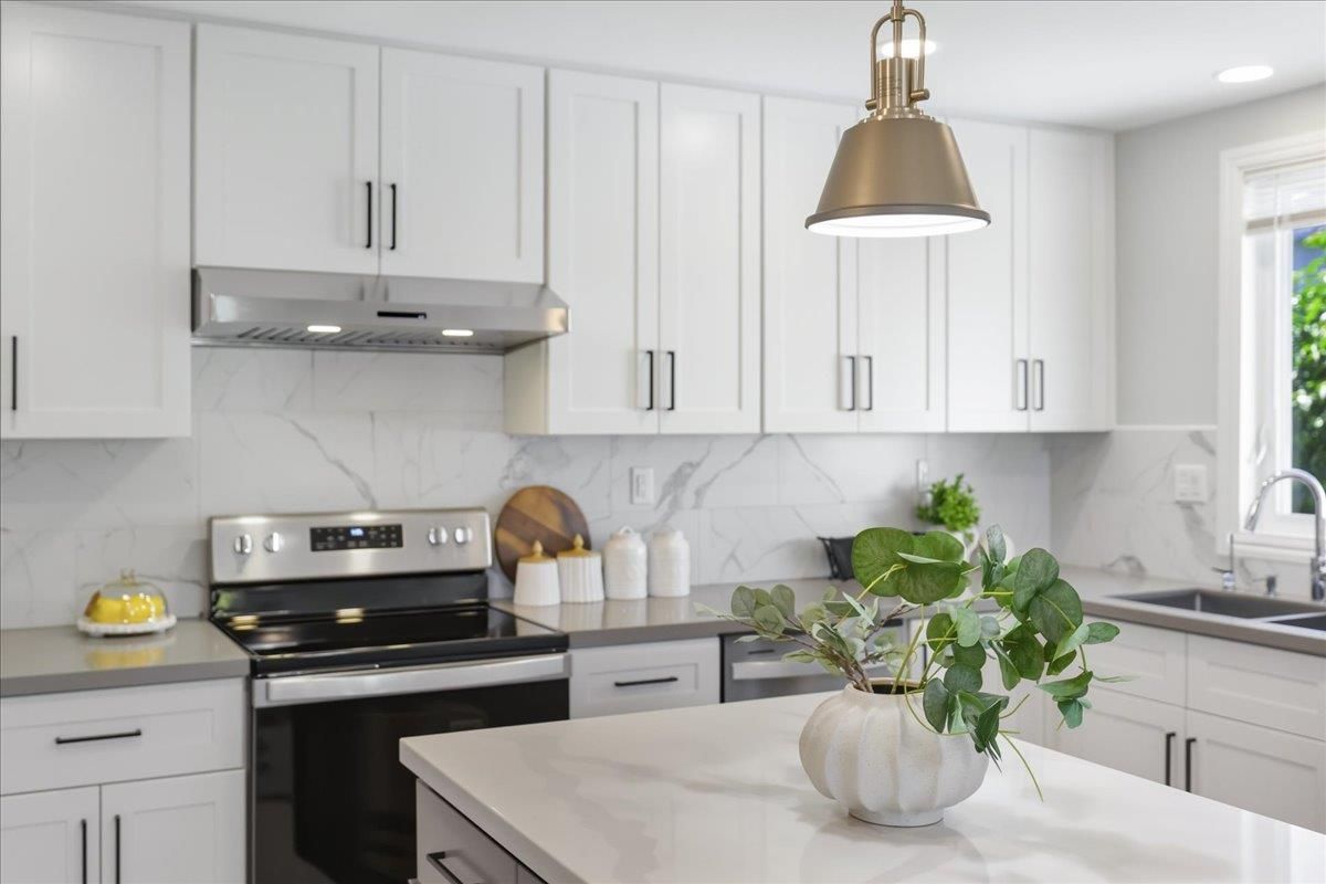 Interior, Kitchen, Marble Walls, Pendant Lights, Recessed Lighting, Stainless Steel Appliances