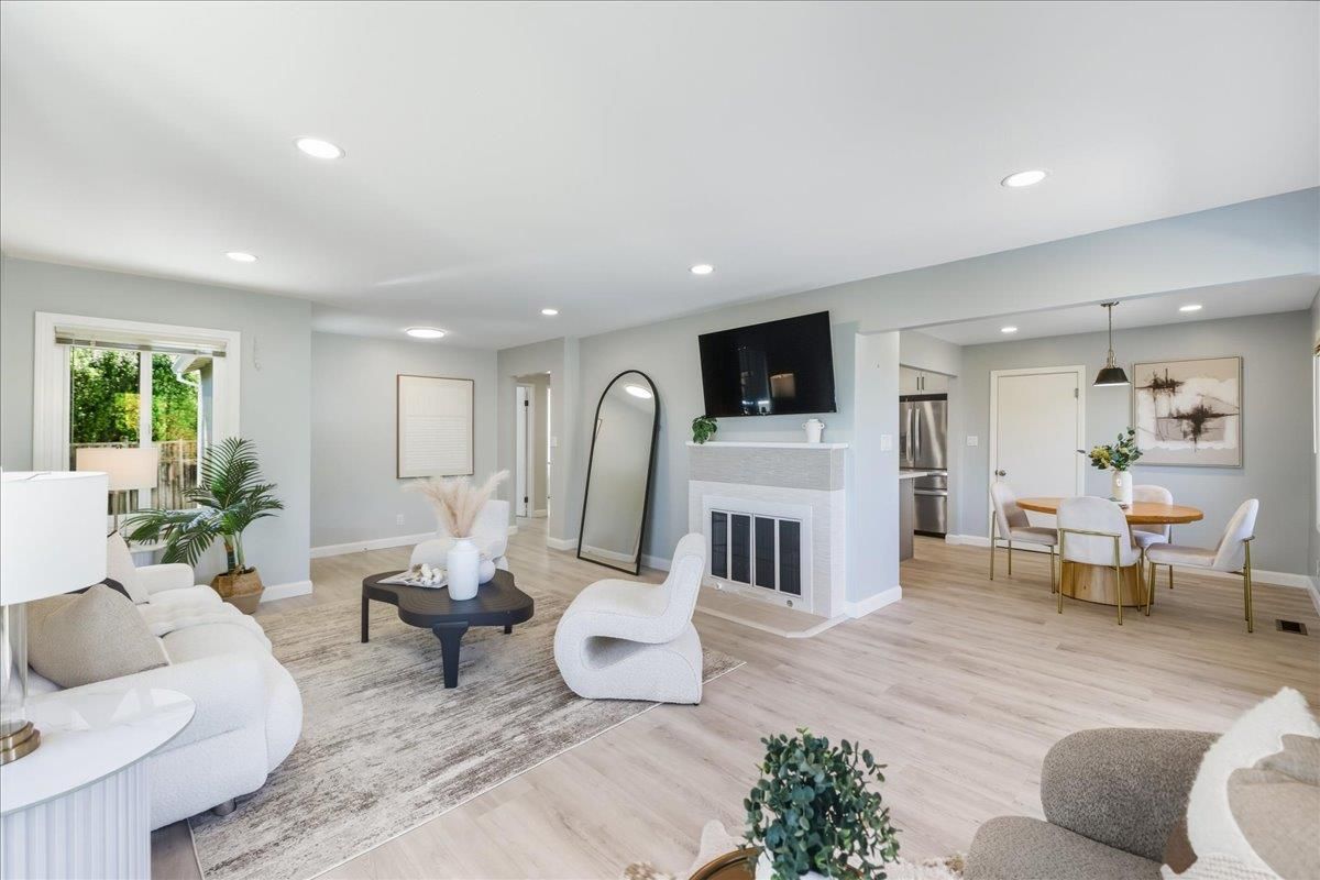 Dining room, Fireplace, Interior, Kitchen, Living room, Recessed Lighting, Stainless Steel Appliances, Wood Texture Flooring