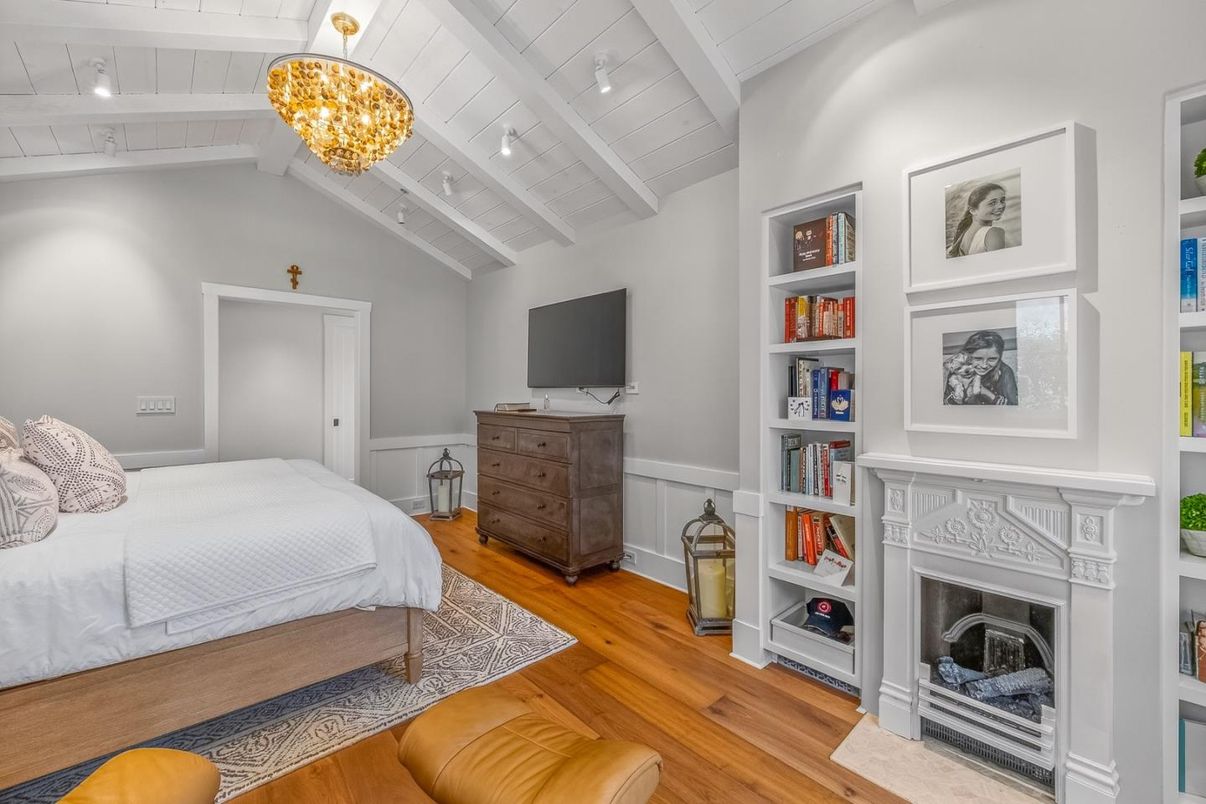 Bedroom, Chandelier, Fireplace, Interior, Recessed Lighting, Wood Texture Flooring