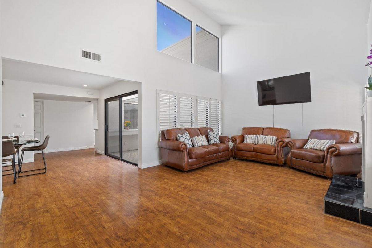 Dining room, Fireplace, Interior, Living room, Recessed Lighting, Wood Texture Flooring