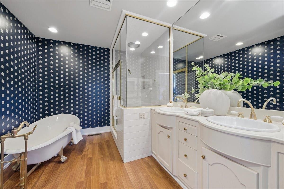 Bathroom, Dual Sink Vanities, Free Standing Baths, Glass Shower, Interior, Recessed Lighting, Wood Texture Flooring