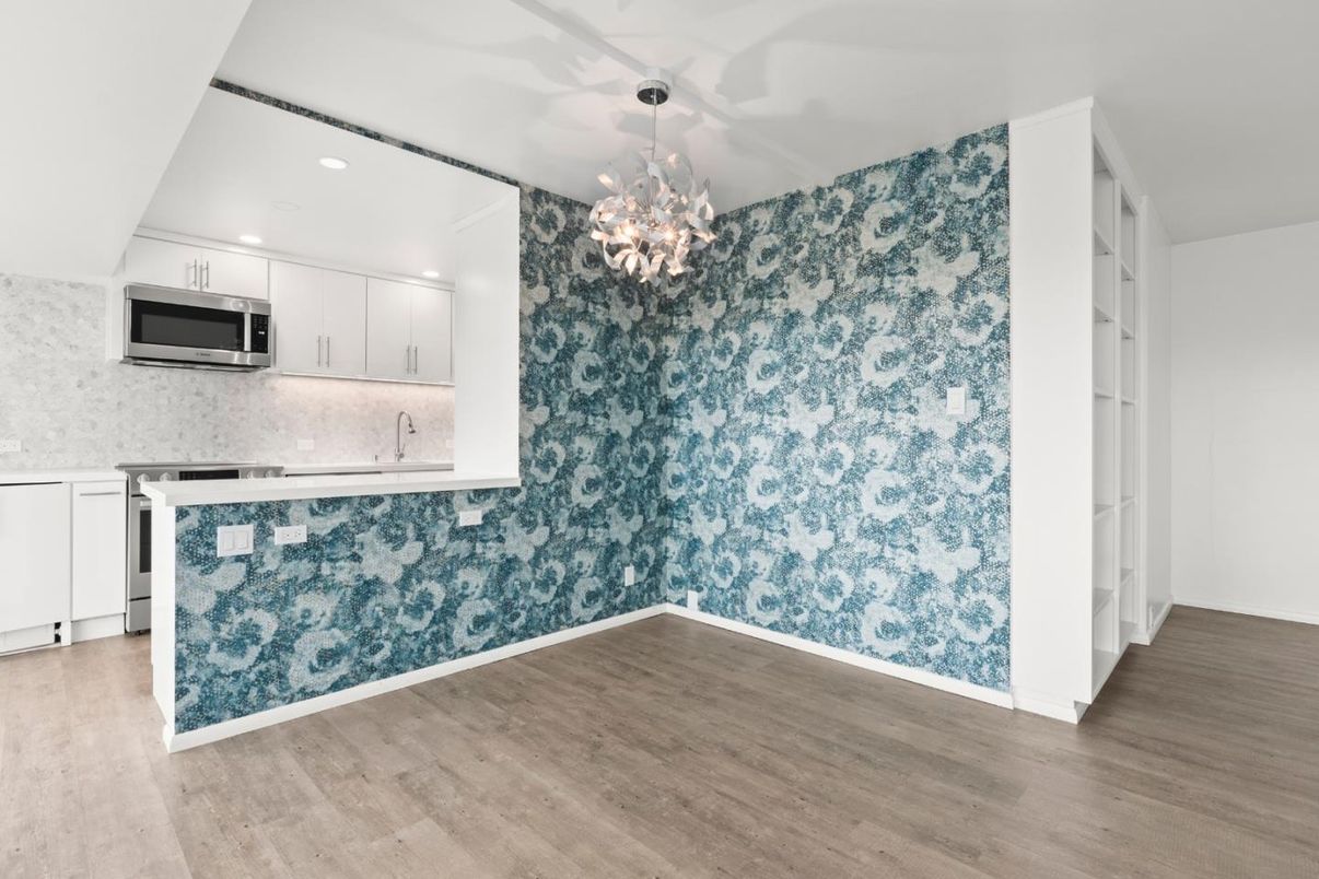 Chandelier, Empty room, Interior, Kitchen, Recessed Lighting, Stainless Steel Appliances, Wood Texture Flooring