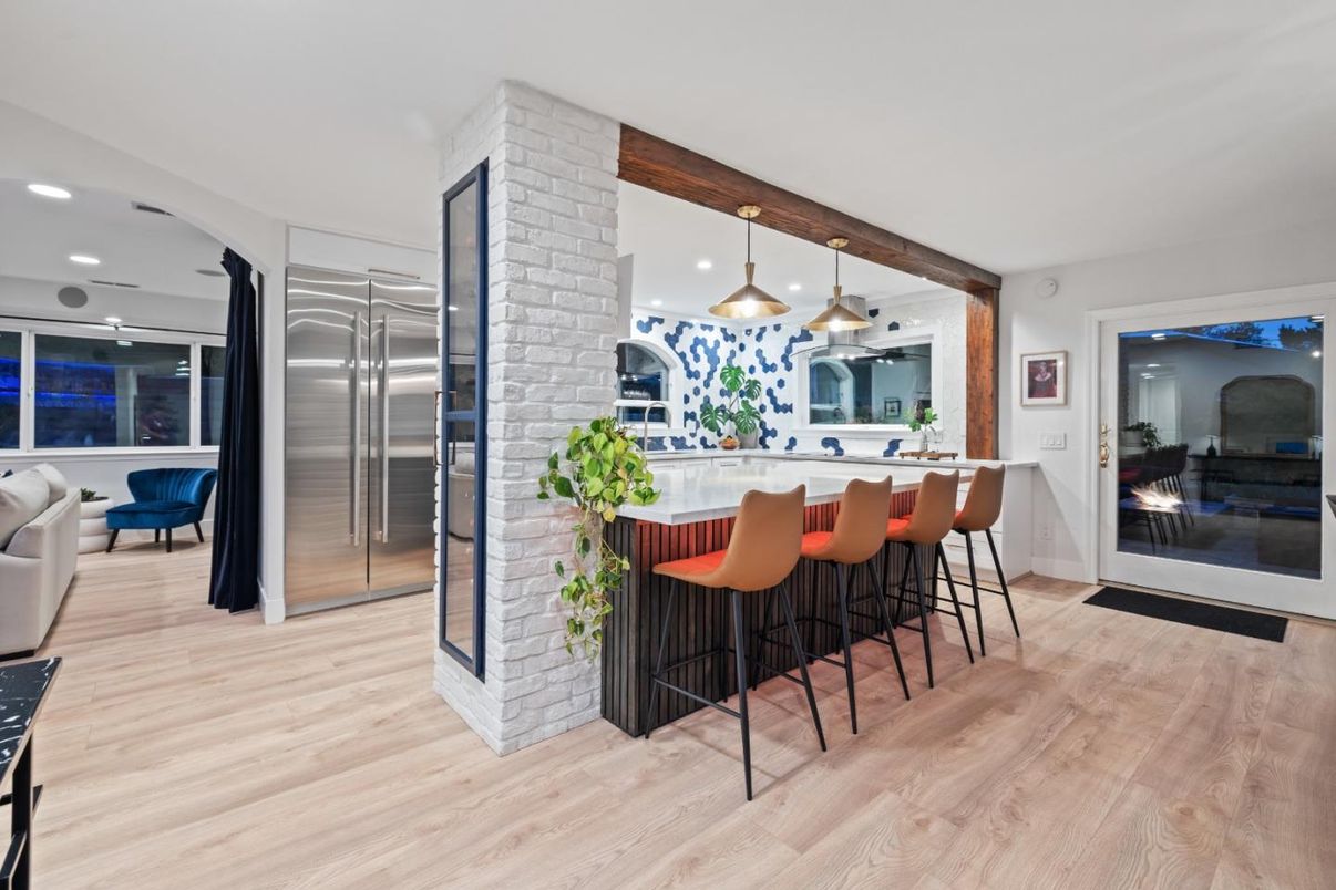 Fireplace, Interior, Kitchen, Pendant Lights, Recessed Lighting, Stainless Steel Appliances, Stone Walls, Wood Texture Flooring