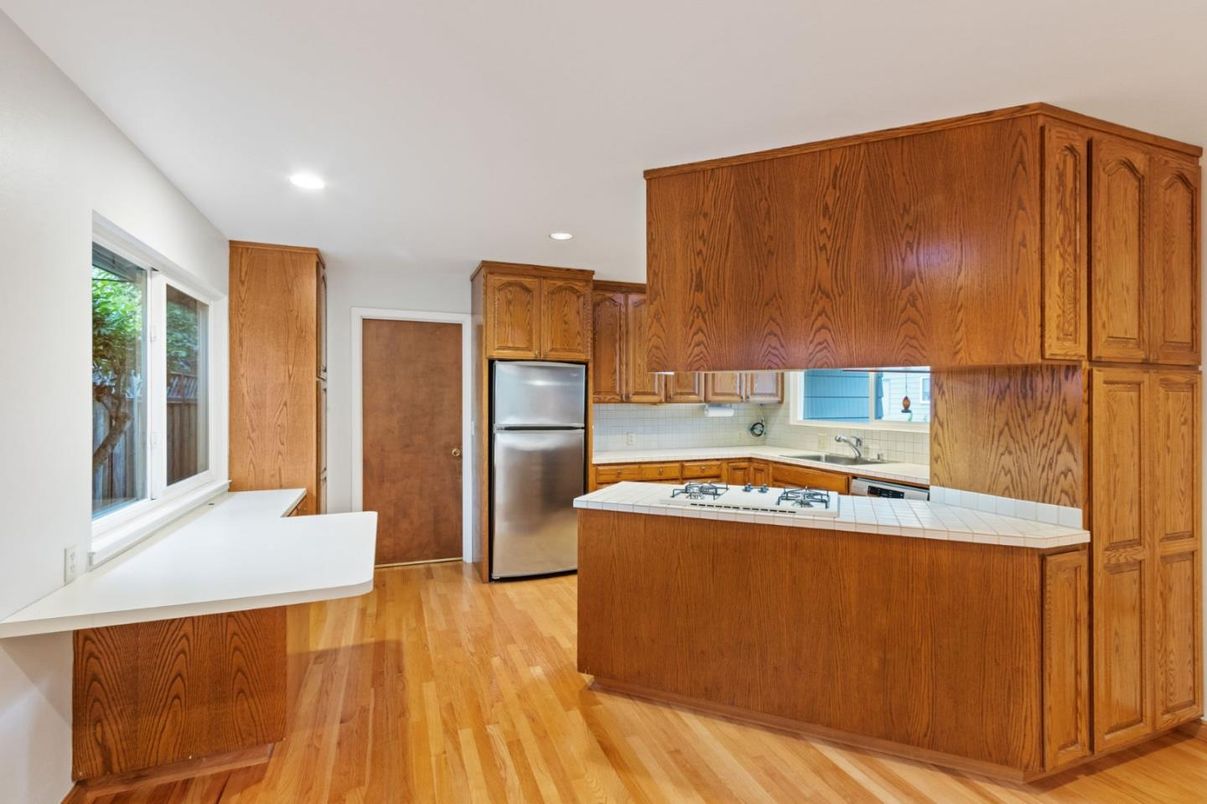 Interior, Kitchen, Recessed Lighting, Tile Countertops, Wood Texture Flooring