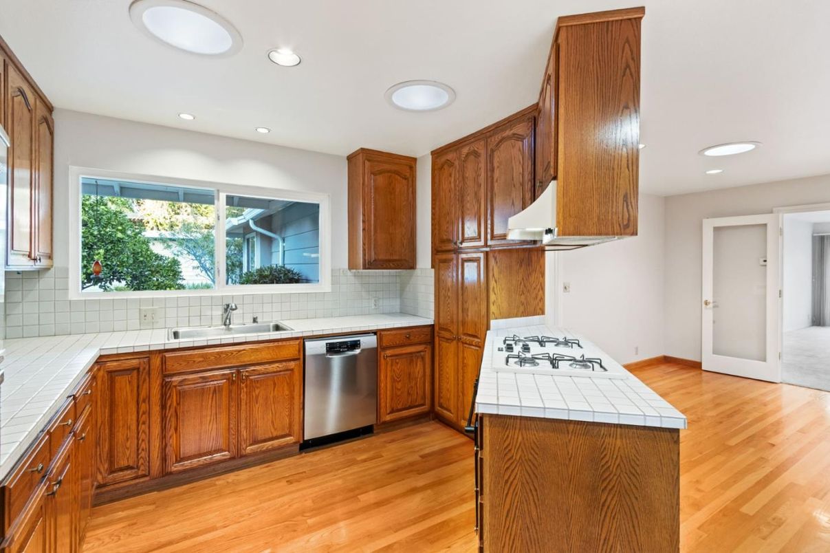 Interior, Kitchen, Recessed Lighting, Tile Countertops, Wood Texture Flooring