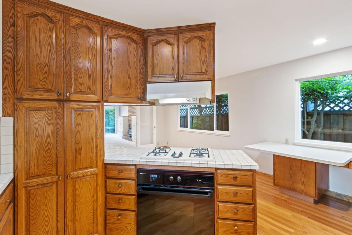 Interior, Kitchen, Recessed Lighting, Tile Countertops, Wood Texture Flooring