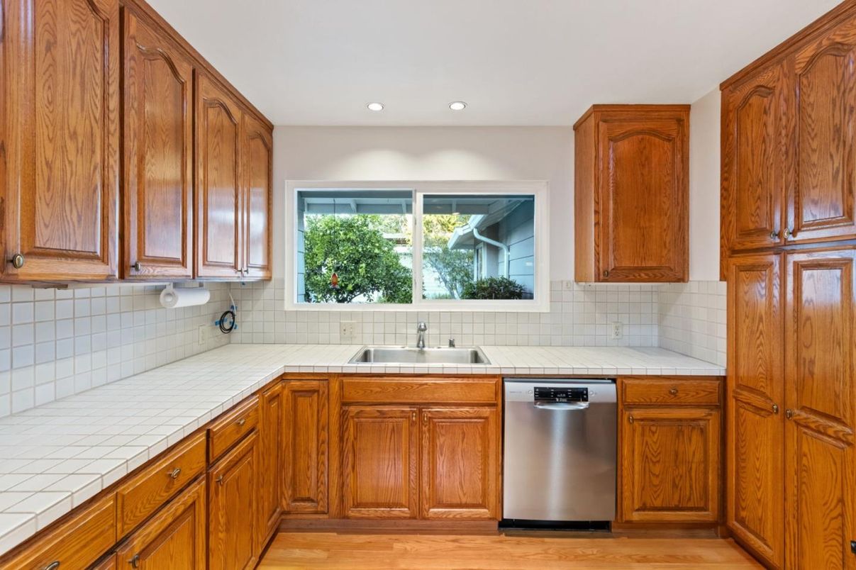 Interior, Kitchen, Recessed Lighting, Tile Countertops, Wood Texture Flooring