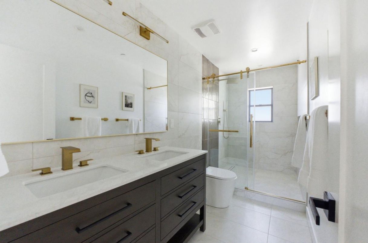 Bathroom, Dual Sink Vanities, Glass Shower, Interior, Marble Walls, Recessed Lighting