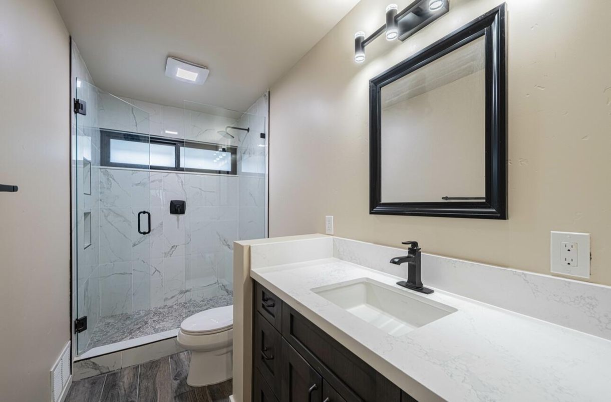 Bathroom, Glass Shower, Interior, Marble Walls, Wood Texture Flooring