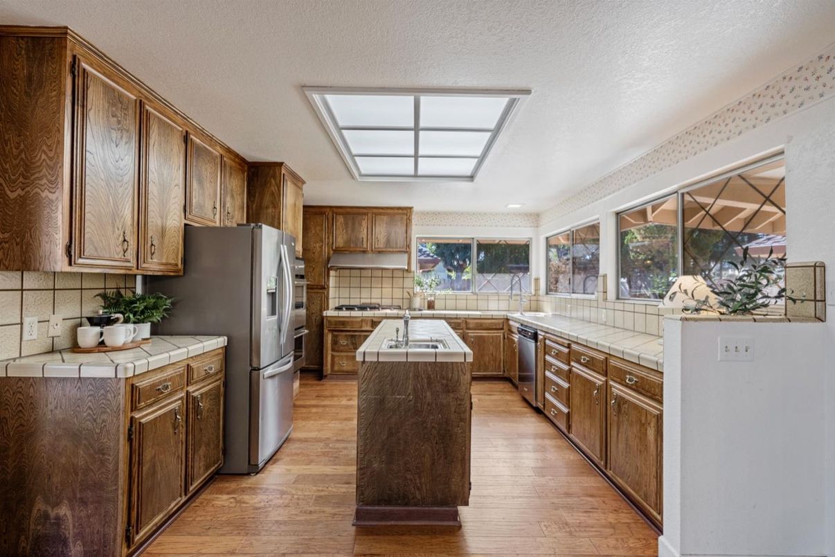 Interior, Kitchen, Recessed Lighting, Tile Countertops, Wood Texture Flooring
