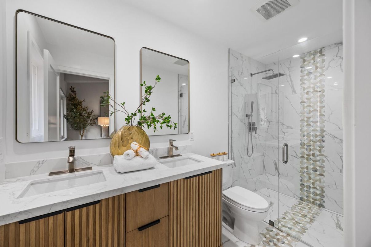 Bathroom, Dual Sink Vanities, Glass Shower, Interior, Marble, Marble Walls, Recessed Lighting