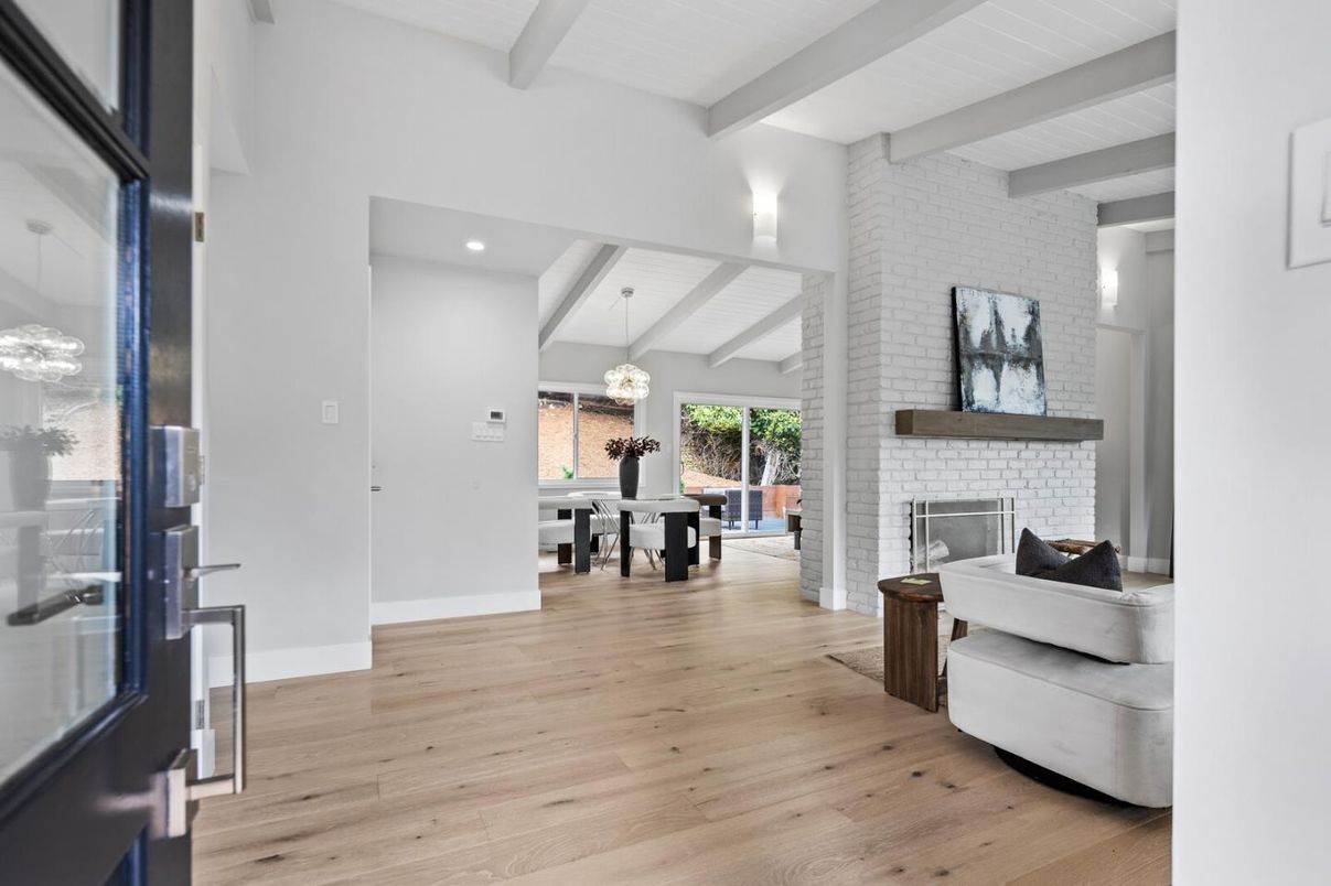 Chandelier, Dining room, Fireplace, Interior, Pendant Lights, Recessed Lighting, Stone Walls, Wood Texture Flooring