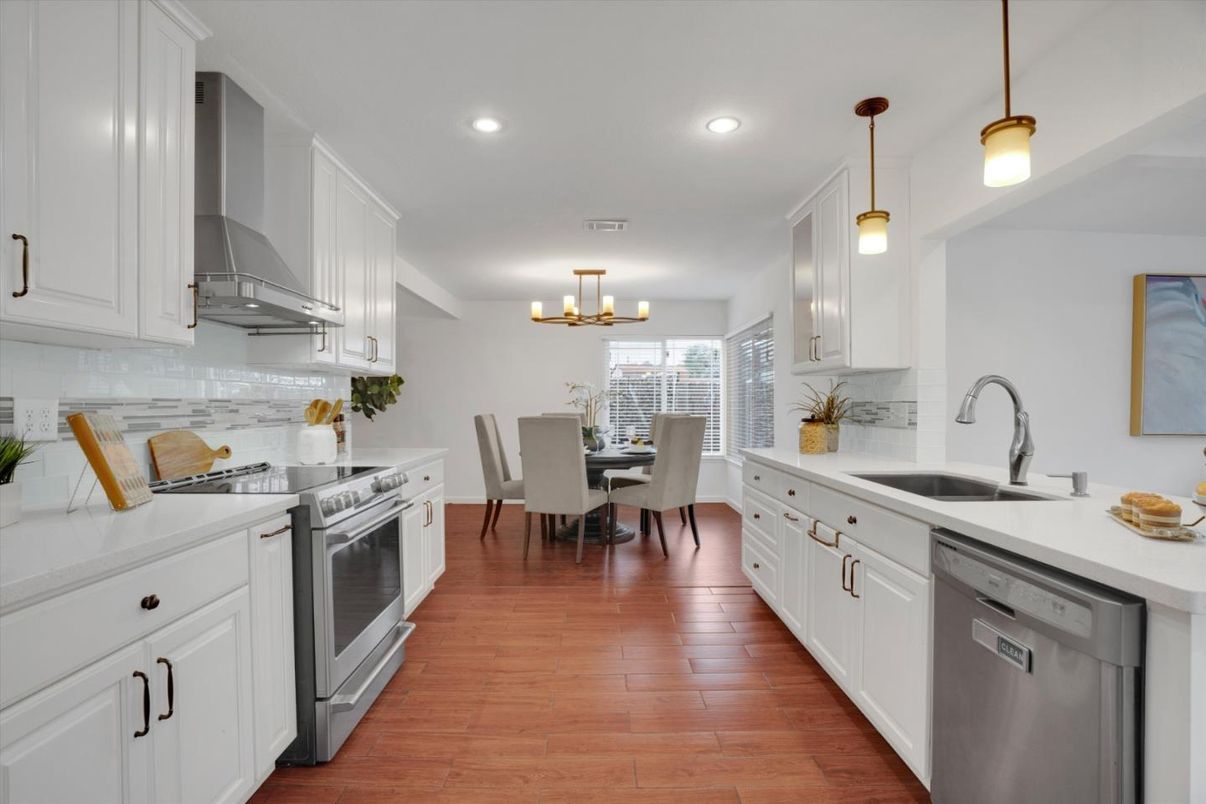 Dining room, Interior, Kitchen, Pendant Lights, Recessed Lighting, Stainless Steel Appliances, Wood Texture Flooring