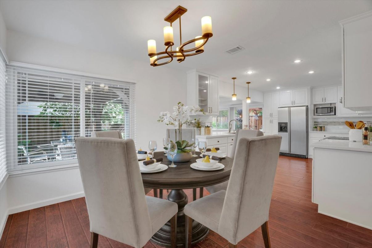 Chandelier, Dining room, Interior, Kitchen, Pendant Lights, Recessed Lighting, Stainless Steel Appliances, Wood Texture Flooring