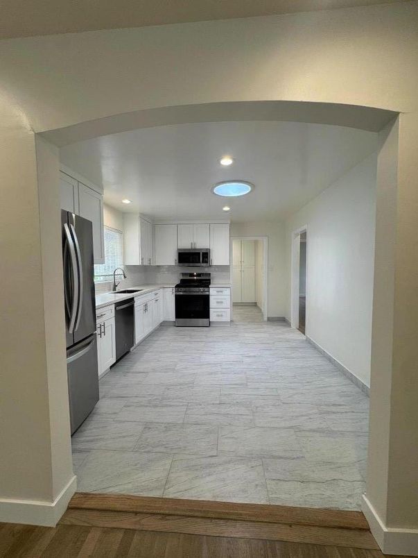 Interior, Kitchen, Marble, Recessed Lighting, Stainless Steel Appliances, Wood Texture Flooring