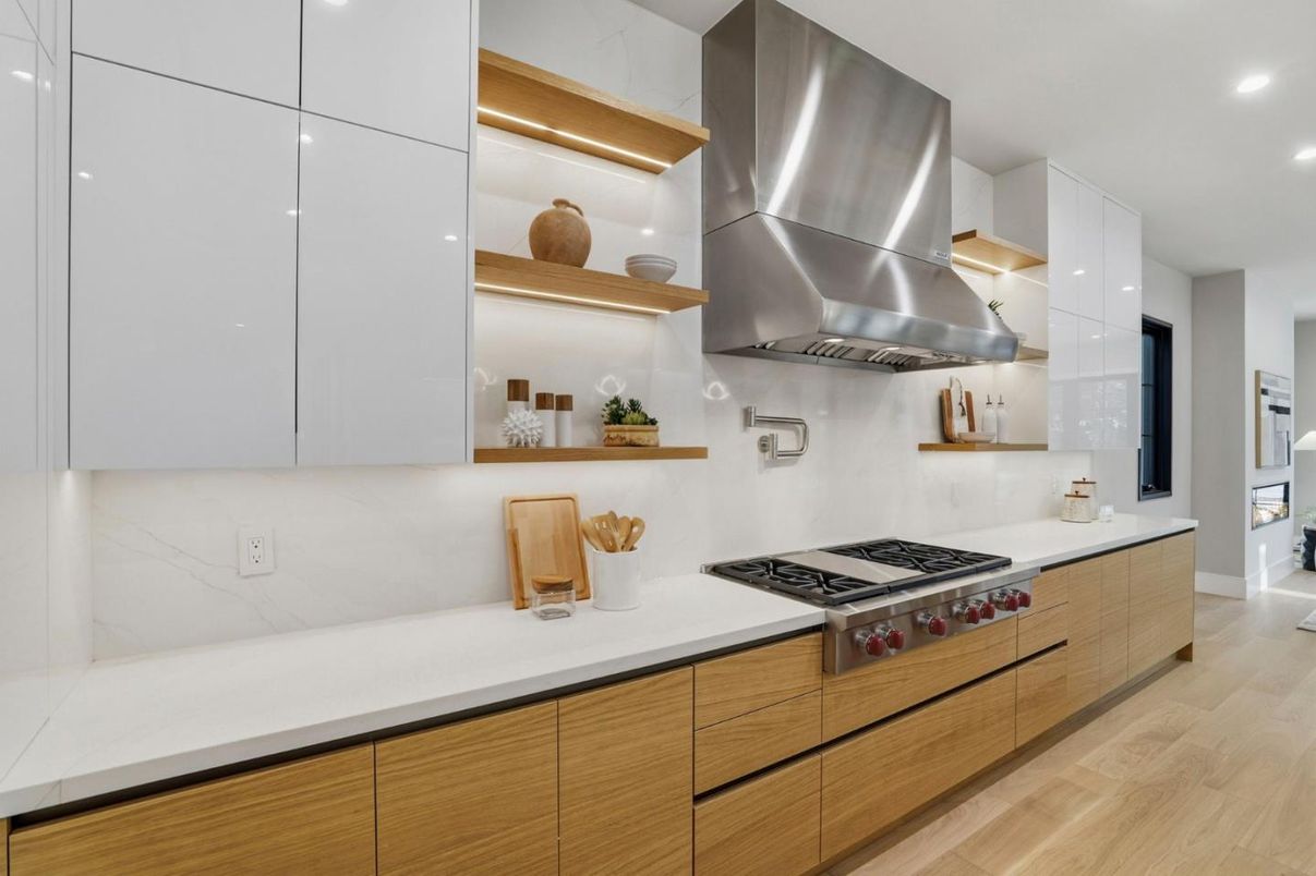 Interior, Kitchen, Marble Walls, Recessed Lighting, Stainless Steel Appliances, Wood Texture Flooring